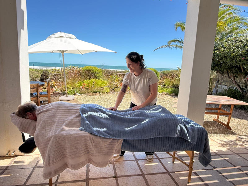 Outdoor Paternoster beachfront massage therapy session with ocean view and relaxing spa environment